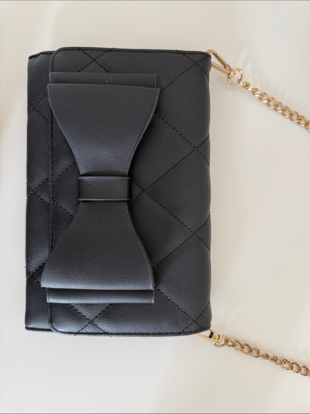 Black Quilted Crossbody Bag with Bow Accent